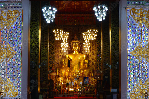Budhha statue at Wat Phra That Hariphunchai temple in Lamphun, Thailand.