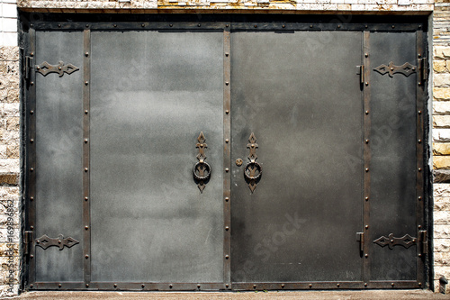 Iron gate in a brick wall