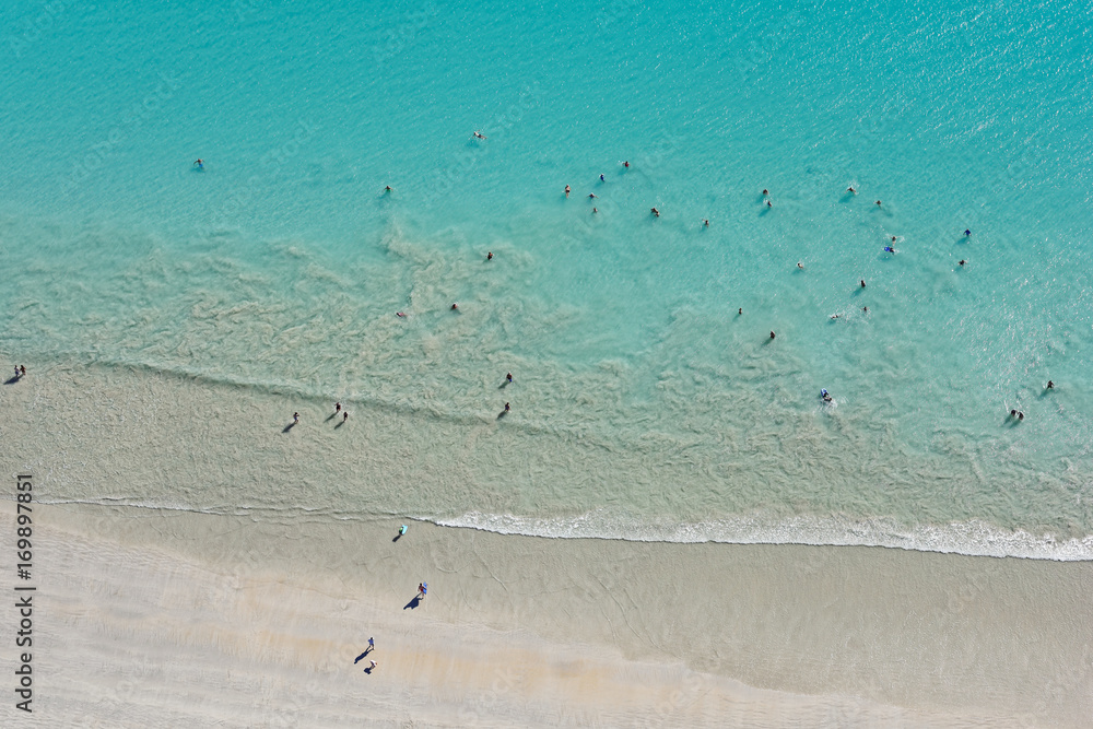 Looking down upon people enjoying the wide sands and waters of Cable Beach Looking down upon people enjoying the wide sands and waters of Cable Beach