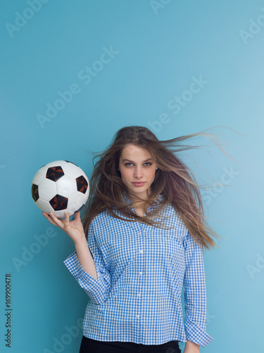 young woman playing with a soccer ball