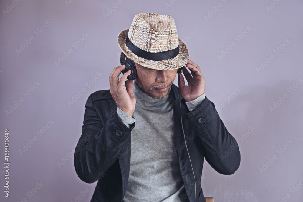 Portrait of Handsome middle aged man with beard smiling having a restful moment,vintage style Portrait of Handsome middle aged man with beard smiling having a restful moment,vintage style