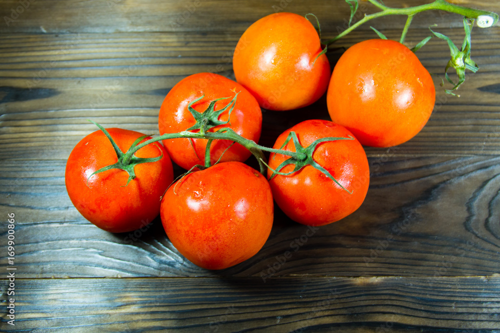 Ripe red tomatoes on wooden table Ripe red tomatoes on wooden table