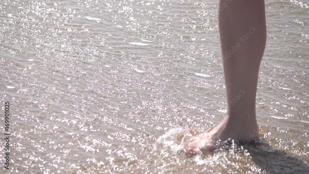 High quality video of woman walking in the water in real 1080p slow motion 250fps High quality video of woman walking in the water in real 1080p slow motion 250fps