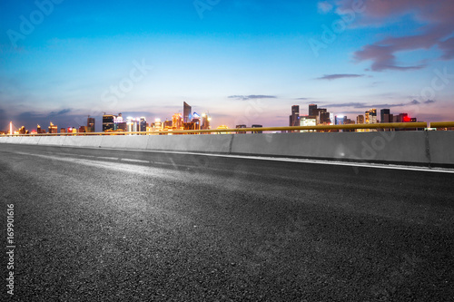 empty asphalt road with cityscape of modern city