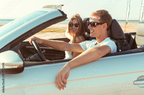 Young couple traveling by car