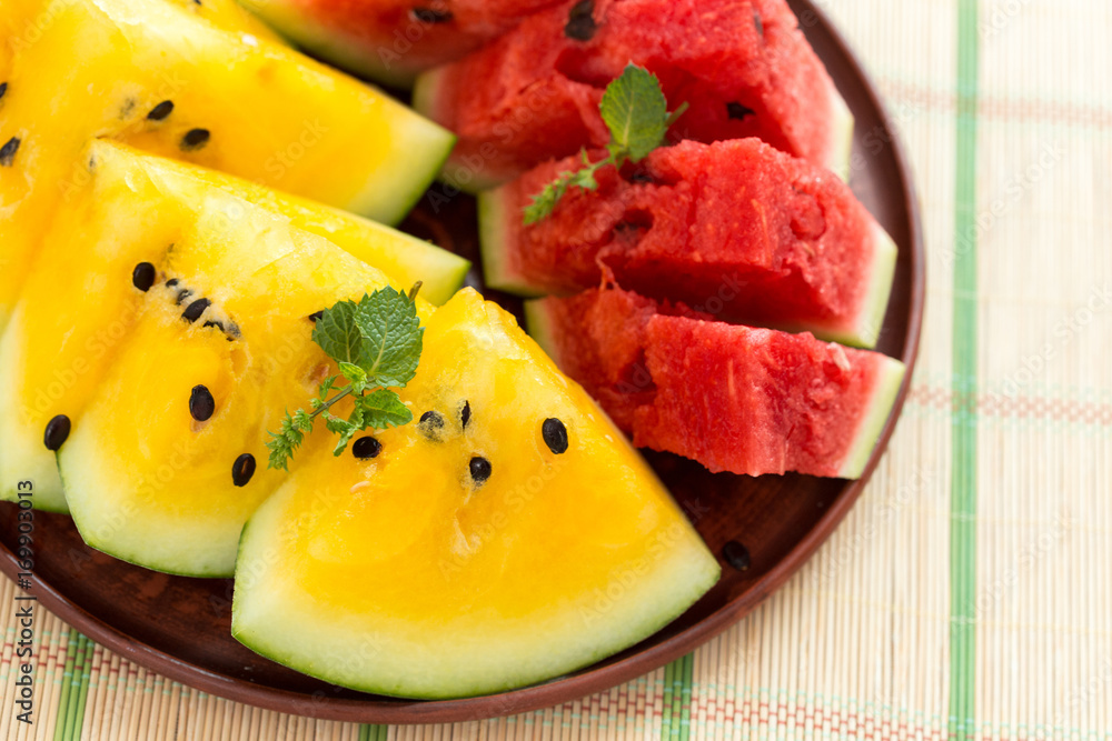 Yellow watermelon sliced on wooden background Yellow watermelon sliced on wooden background