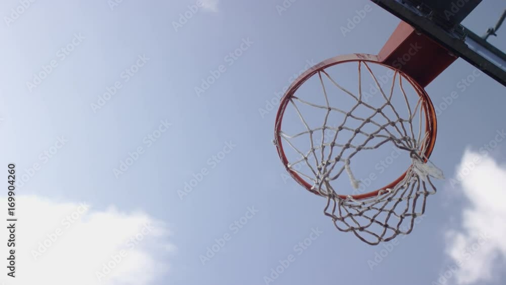 Basketball misses and hits the ring and bounces off, in slow motion Basketball misses and hits the ring and bounces off, in slow motion