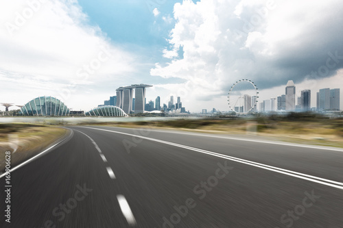 empty asphalt road with cityscape of singapore