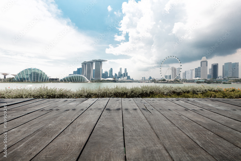 empty wooden floor with cityscape of modern city