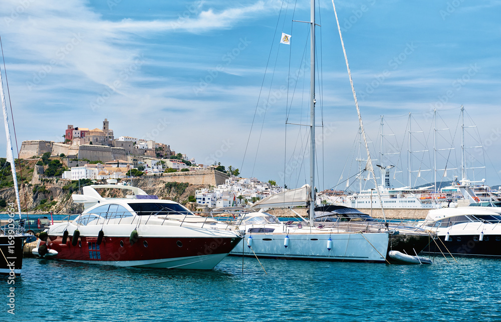 Obraz premium Dalt Vila old town and moored vessels in the port of Ibiza. Spain