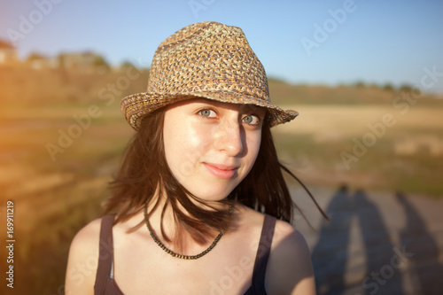portrait of a young girl in a straw hat in the Park © fotoru