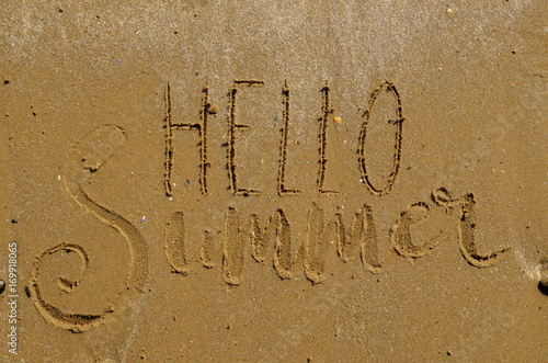 HELLO SUMMER hand lettering in the sand