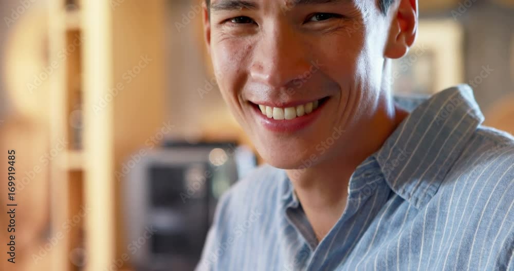 Smiling man at counter in restaurant Smiling man at counter in restaurant