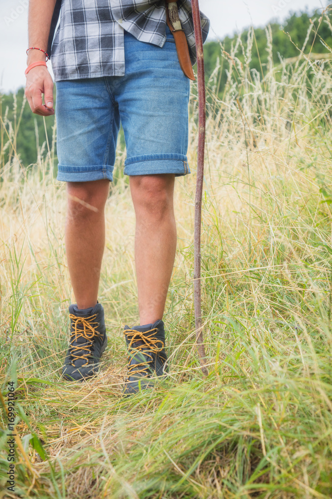 Young hiker in nature / wilderness - trekking outdoors. Young hiker in nature / wilderness - trekking outdoors.