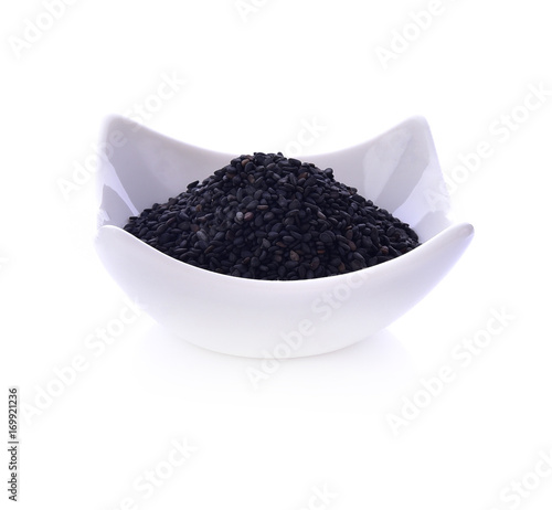 Black Sesame Seeds in bowl on white background