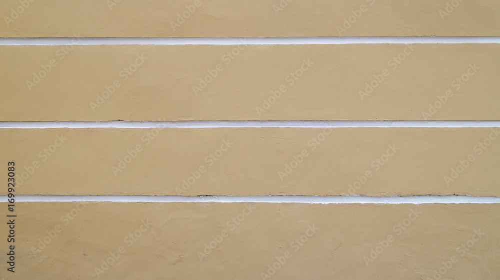 Yellow wall with white horizontal stripes