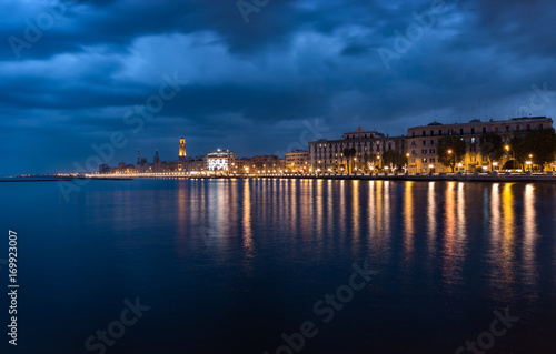 Bari italy night cityscape coastline from sea. Citylights at seafront after sunset
