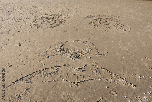 Face Carved in Sand