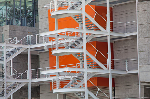 Fire escape ladder on the side of a new building photo