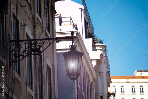 Old street lamp on a classical facade in Lisbon