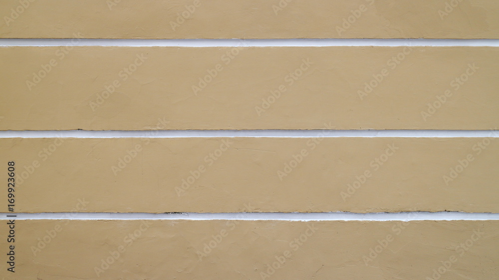 Yellow wall with white horizontal stripes