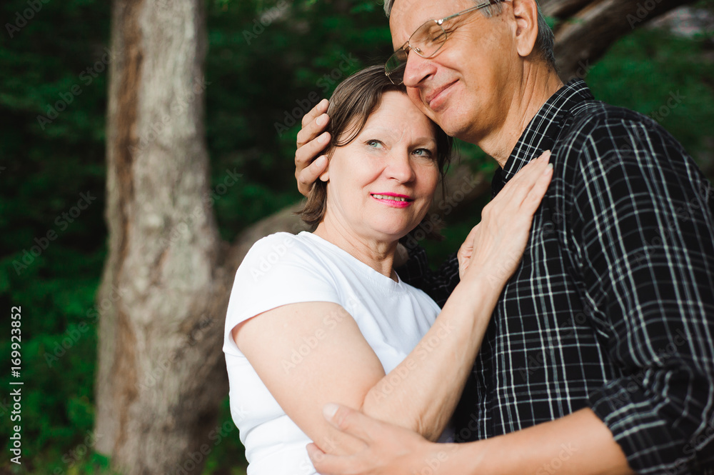 Senior couple strolling in the park Senior couple strolling in the park