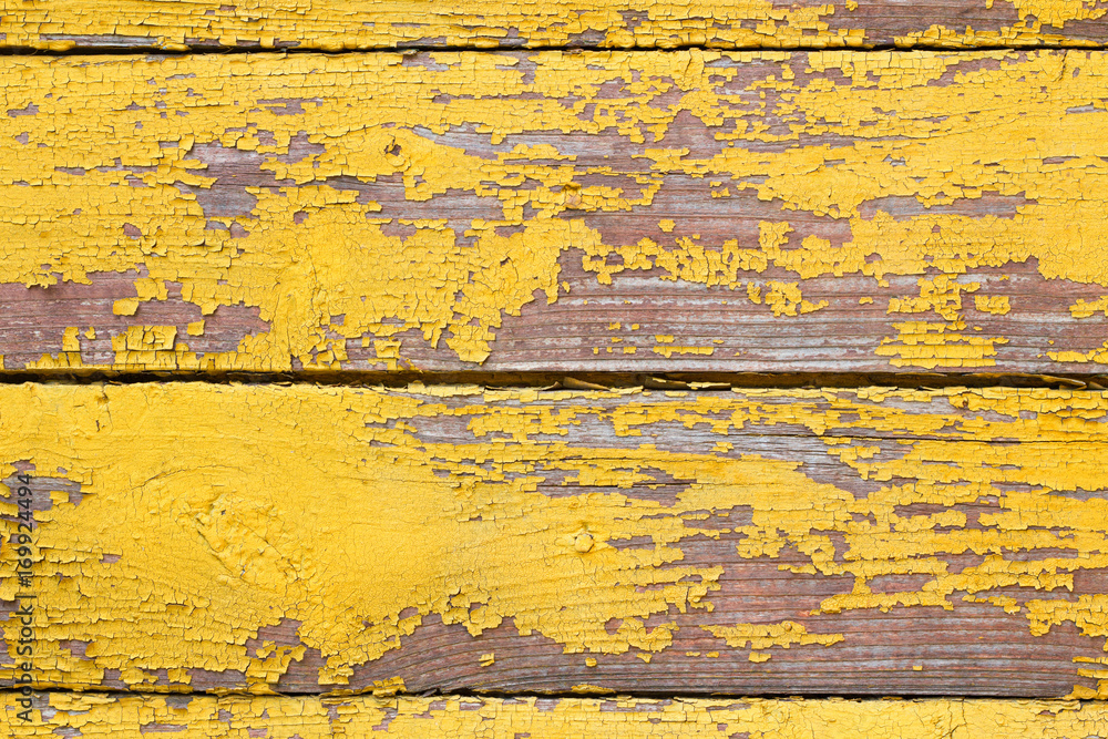 Old wooden shabby yellow background or texture, part of rustic fence or walls of house Old wooden shabby yellow background or texture, part of rustic fence or walls of house