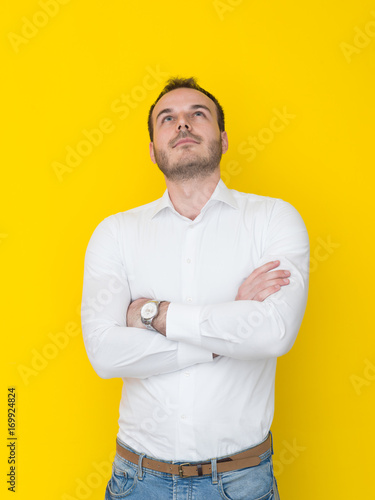 man isolated over a yellow background © .shock