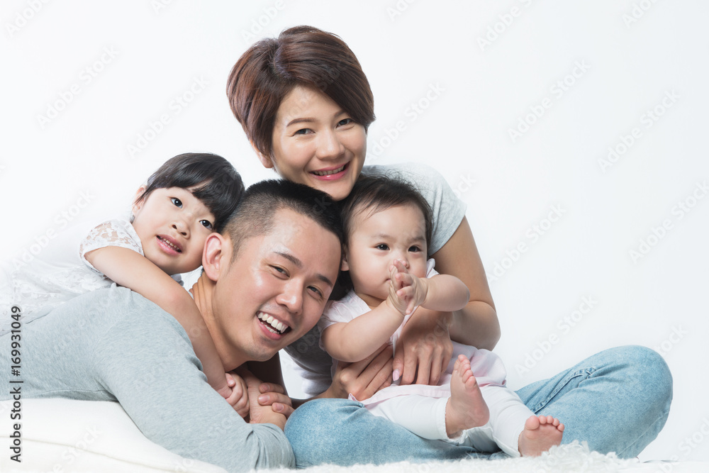 Young happy Asian family with kids