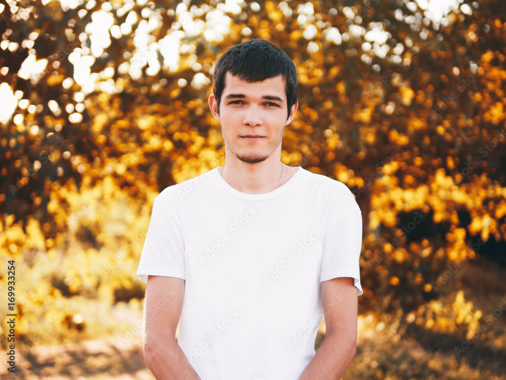 autumn portrait of a young man front view autumn background autumn portrait of a young man front view autumn background