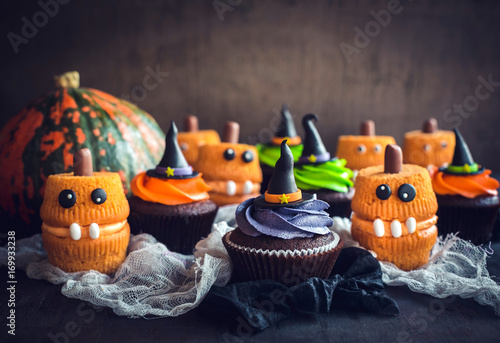 Scary Halloween cup cakes on the table,selective focus