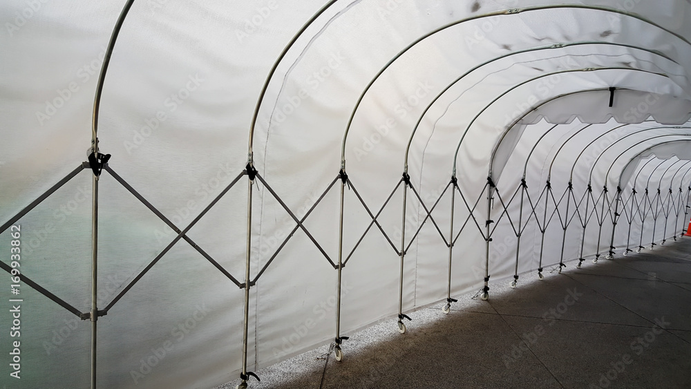 Fototapeta premium tunnel, frame made of white plastic arcs abstract image