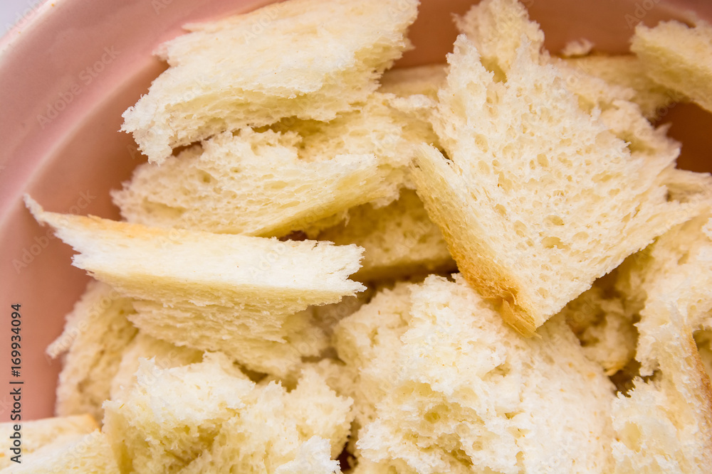 Close up pieces of bread in bowl
