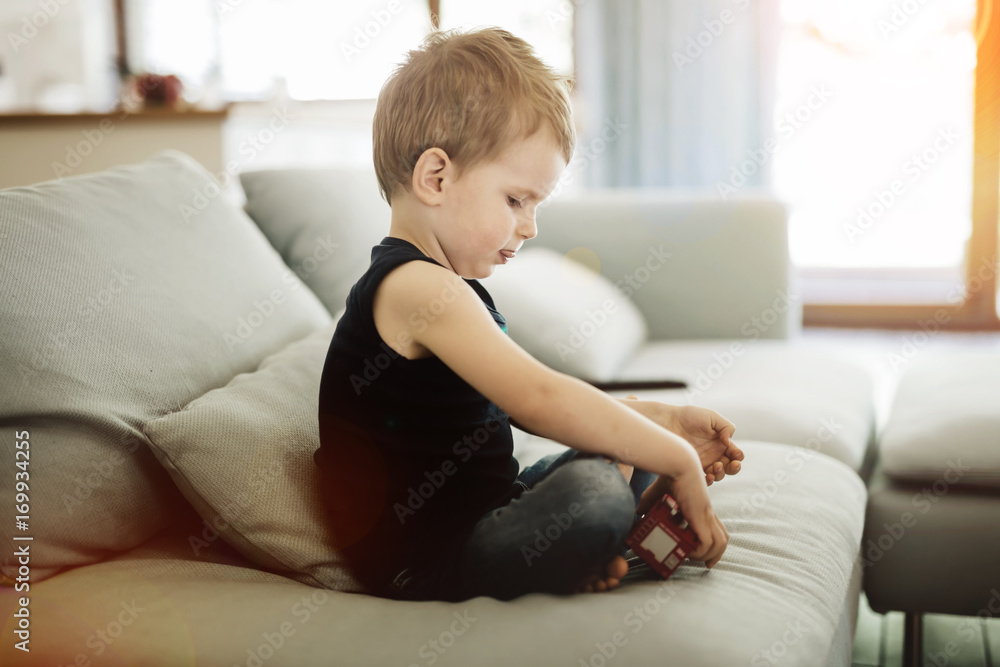 Beautiful toddler playing with his toy Beautiful toddler playing with his toy