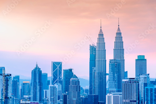 Landscape of Kuala Lumpur skyscraper with colorful sunrise sky, Malaysia.