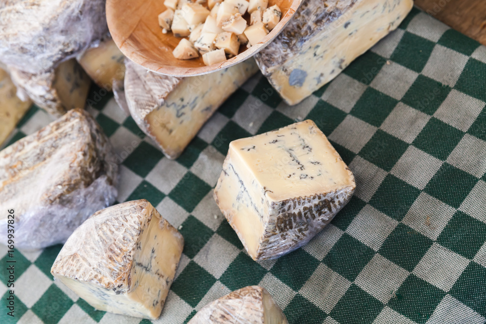 Dutch blue cheese pieces lay on the table Dutch blue cheese pieces lay on the table