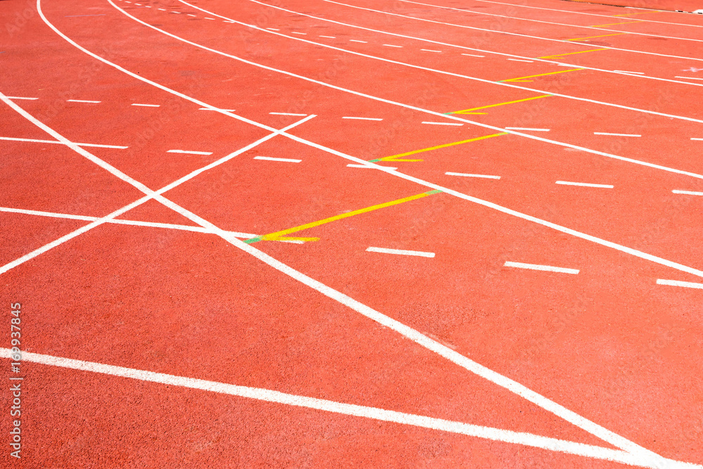 red running track on athletic stadium