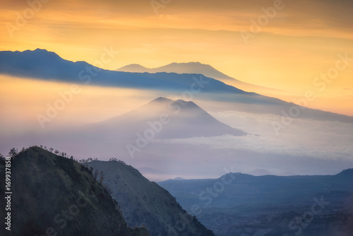 Beautiful mountain and sea of clouds view during sunrise from viewpoint at Bromo Tengger Semeru National Park  East Java  Indonesia.