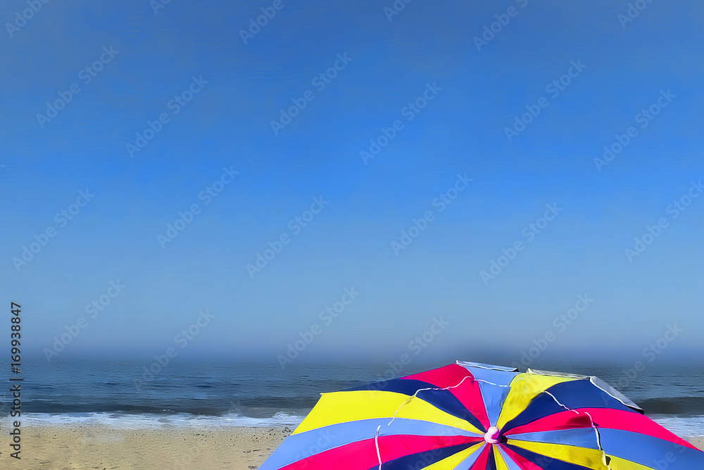 Top of colorful beach umbrella under a blue sky