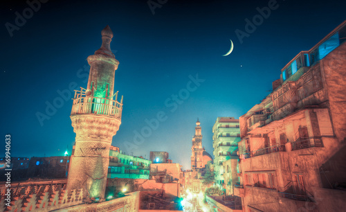 Old cairo at night with crescent photo