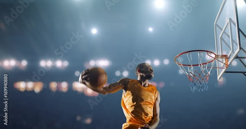 Basketball player scores a goal photo