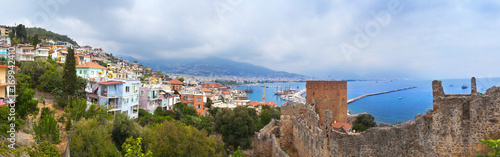 Panoramic view of Alanya harbor and ancient stone wall of Alanya Castle. Alanya, Turkey