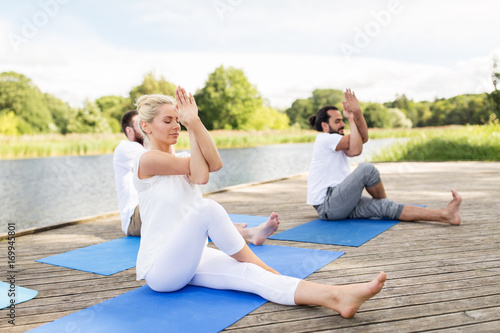 people making yoga and meditating outdoors