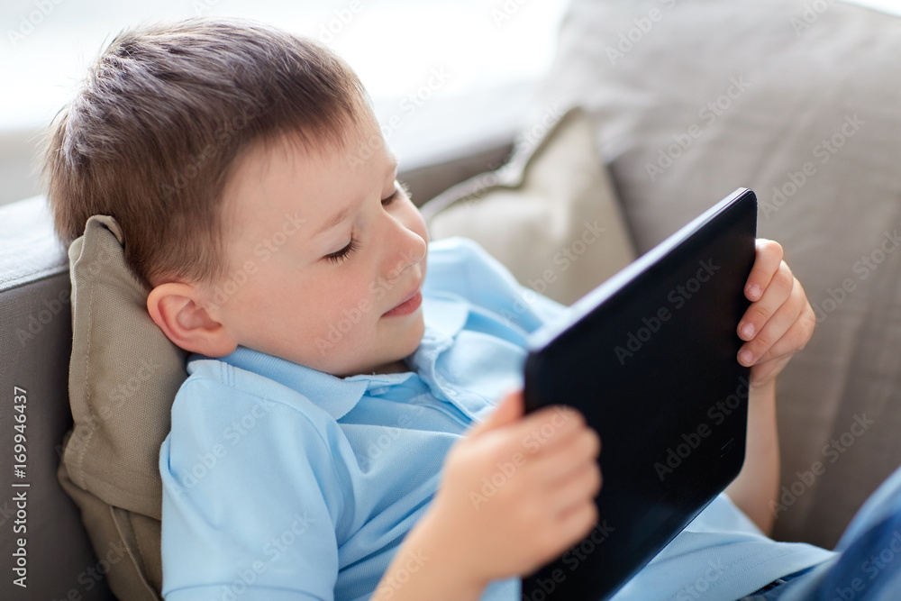 little boy with tablet pc computer at home little boy with tablet pc computer at home