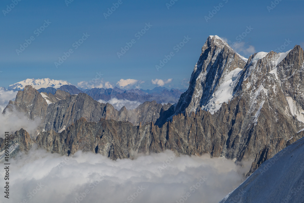 Alpine delight
The Grandes Jorasses, part of the Mont Blanc massive is reaching high above the clouds to an altitude of 4208 meters.