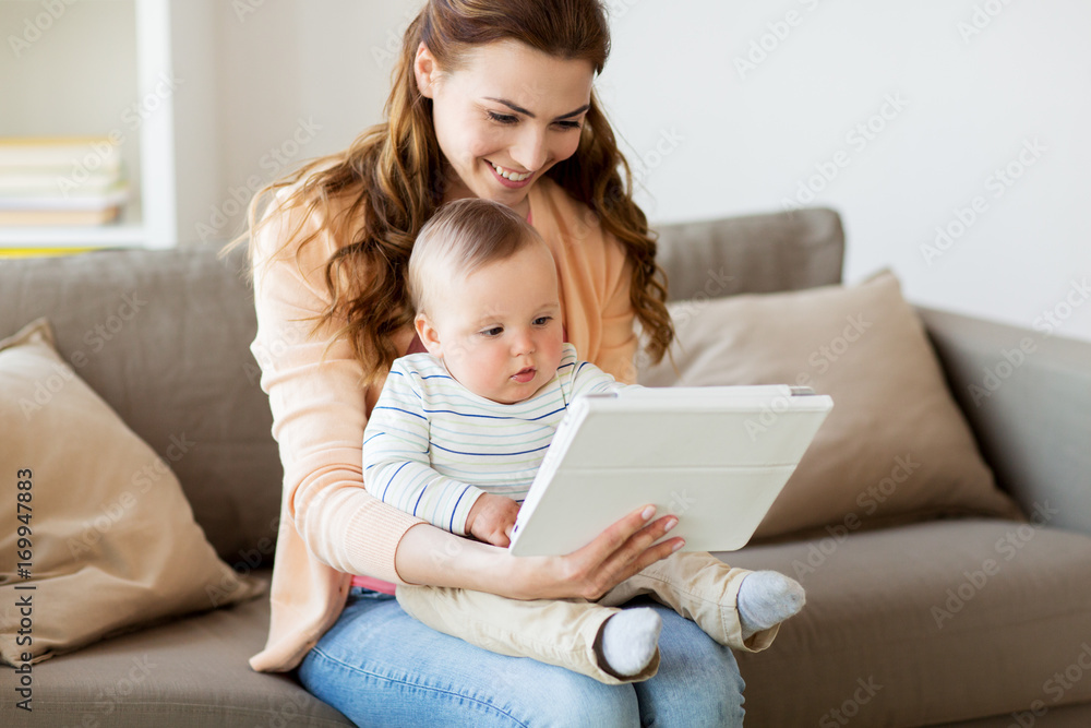 happy mother with baby and tablet pc at home happy mother with baby and tablet pc at home
