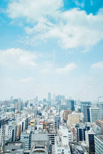 Business concept - panoramic modern city skyline bird eye aerial view with spiral tower and midland square under dramatic cloud and morning bright blue sky on Nagoya TV Tower in Nagoya, Japan