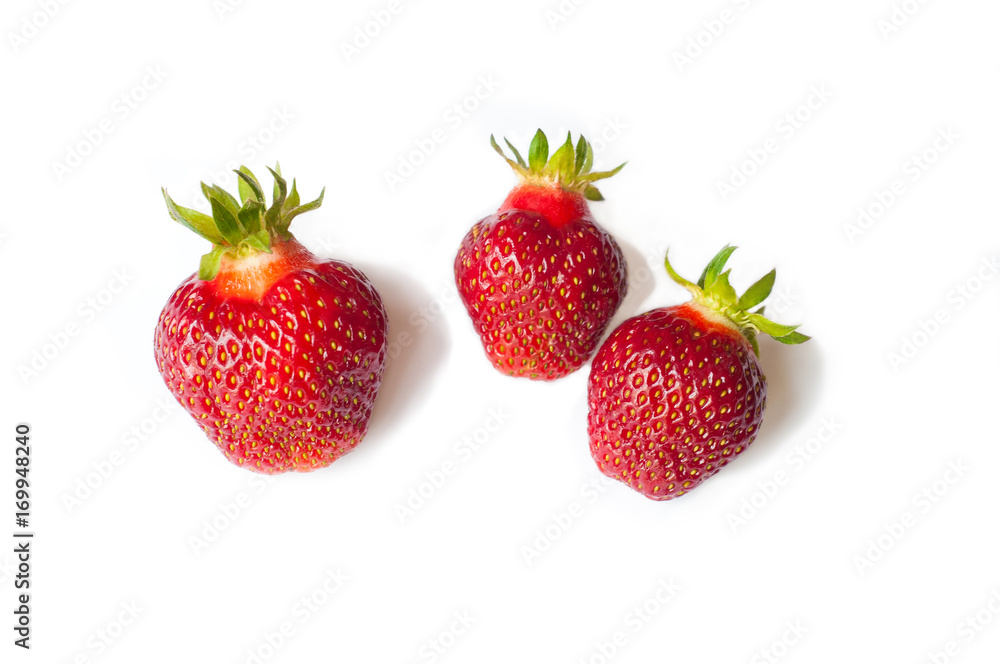 Three Fresh Strawberry isolated on white background. Freshly picked ripe red strawberries. Three Fresh Strawberry isolated on white background. Freshly picked ripe red strawberries.