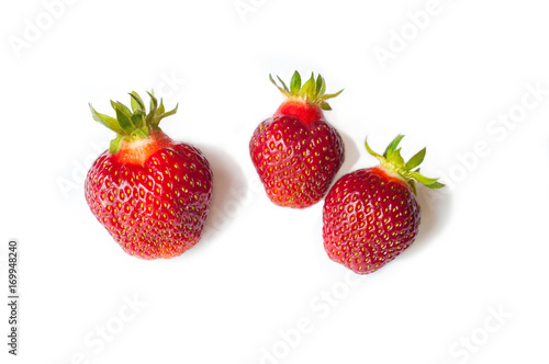 Three Fresh Strawberry isolated on white background. Freshly picked ripe red strawberries.