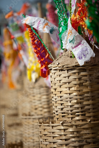 Flag hang Songkran Festival. One of the traditions of northern Thailand. The Hang Tung and colorful embroidery. The pagoda is made of sand photo